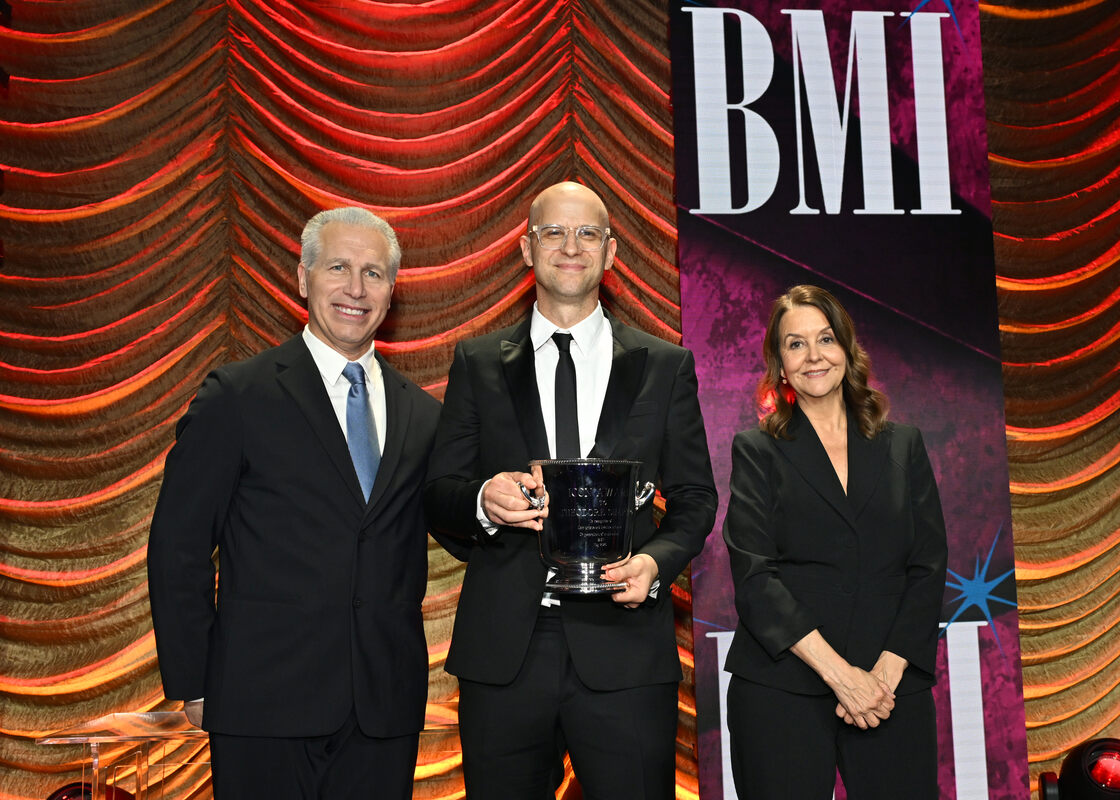 (L-R) Mike Steinberg, EVP, Chief Revenue & Creative Officer, BMI, BMI Icon Honoree Theodore Shapiro, and Tracy McKnight, VP, Creative, Film, TV & Visual Media, BMI pose onstage during the 2026 BMI Film, TV & Visual Media Awards at Beverly Wilshire, A Four Seasons Hotel on May 13, 2026 in Beverly Hills, California. (Photo by Lester Cohen/Getty Images for BMI)