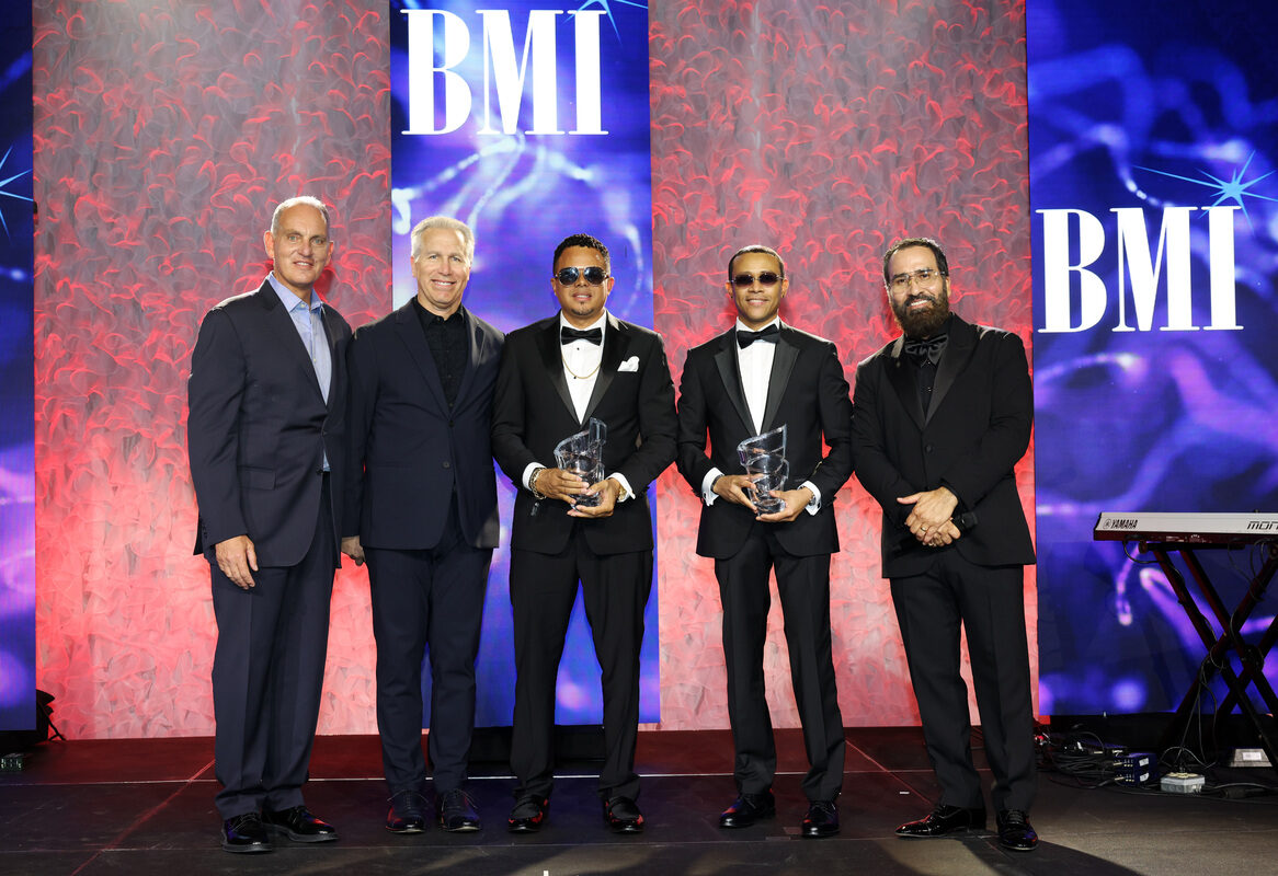 (L-R) Mike O'Neill, BMI CEO, Mike Steinberg, BMI Executive Vice President, Chief Revenue & Creative Officer, BMI President's Award honorees Luny Tunes and Jesus Gonzalez, BMI Vice President, Creative, Latin pose onstage during the 2026 BMI Latin Awards on March 19, 2026 in Miami, Florida. (Photo by Alexander Tamargo/Getty Images)