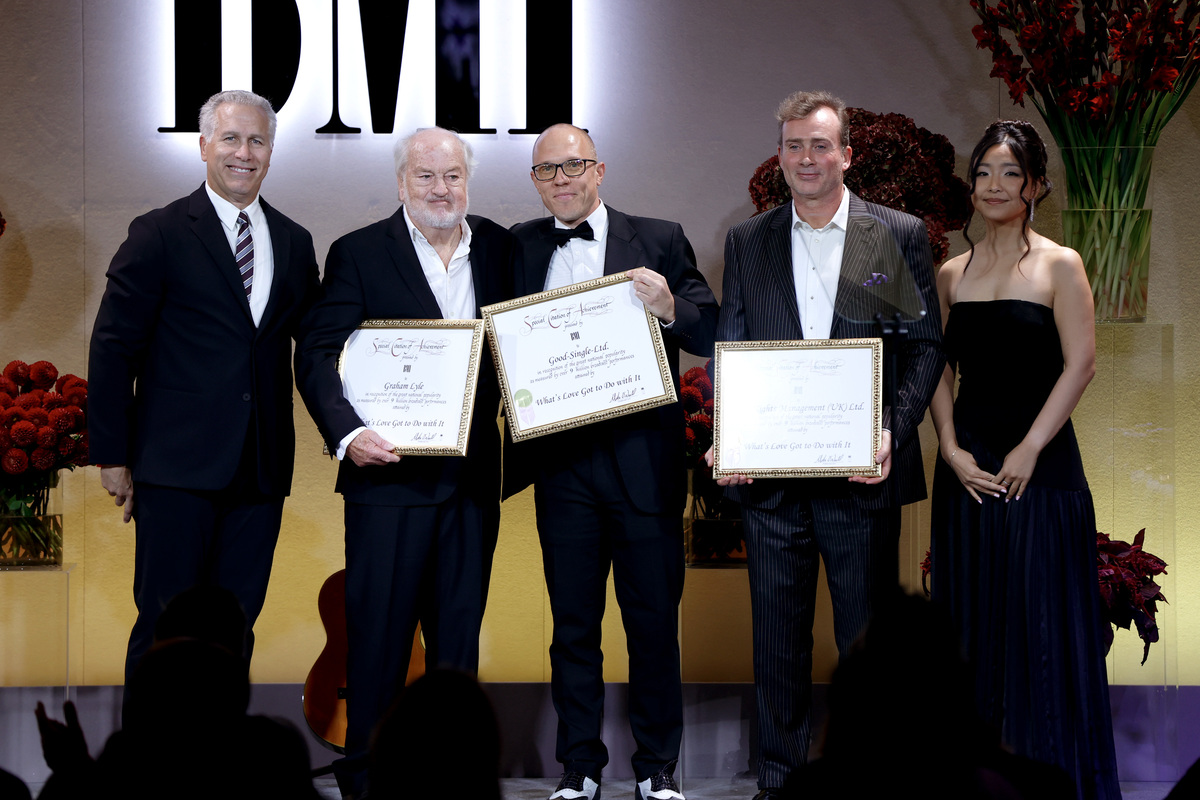 (L-R) Mike Steinberg Executive Vice President, Chief Revenue & Creative Officer, BMI, Graham Lyle, Jon Miller, Director, Creative, Europe, BMI, a guest and Anushka Gantumur, Executive, Creative, Europe, BMI onstage during the 2025 BMI London Awards at The Dorchester on September 29, 2025 in London, England. (Photo by John Phillips/Getty Images for BMI)
