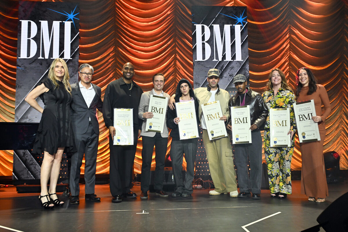 Samantha Cox, VP, Creative, New York, BMI (L) presents the BMI Award for 