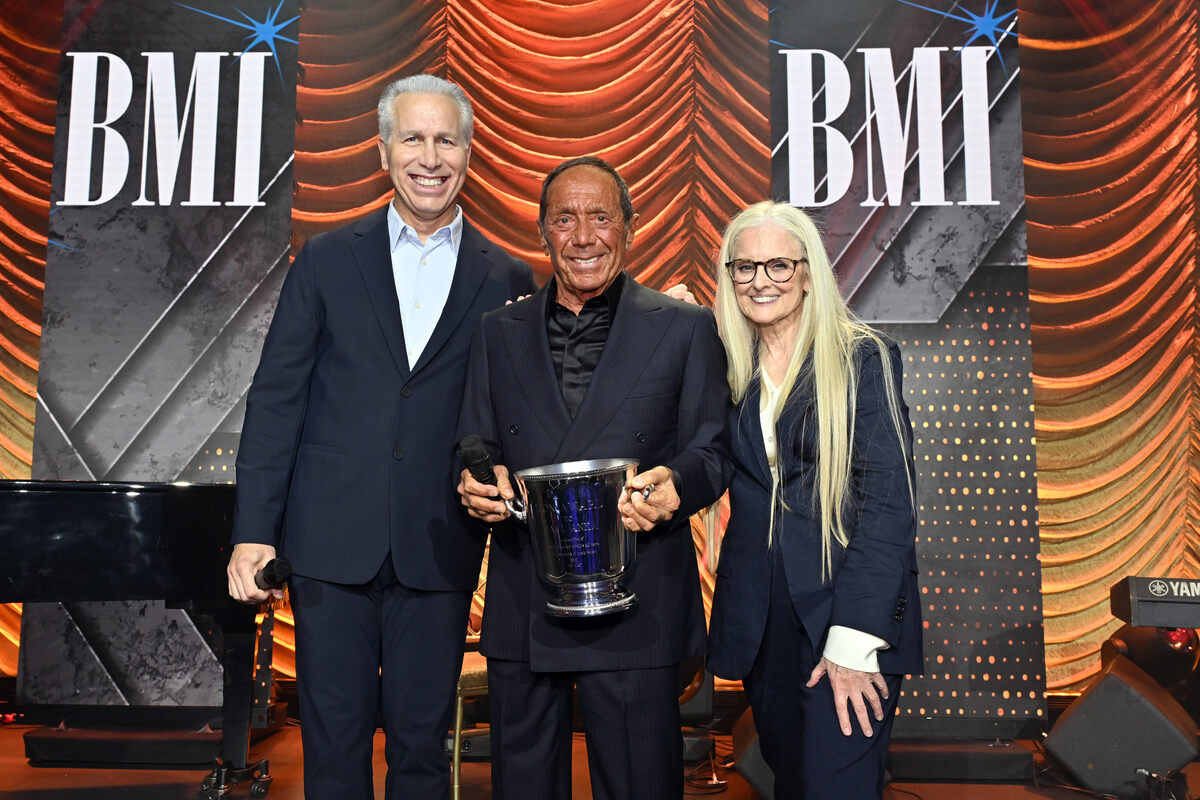 Honoree Paul Anka (C) accepts the BMI Icon Award from Michael Steinberg, EVP, Chief Revenue & Creative Officer, BMI (L), and Barbara Cane, VP, Worldwide Creative, BMI, onstage during the 2026 BMI Pop Awards at Beverly Wilshire, A Four Seasons Hotel on May 12, 2026 in Beverly Hills, California. (Photo by Lester Cohen/Getty Images for BMI)