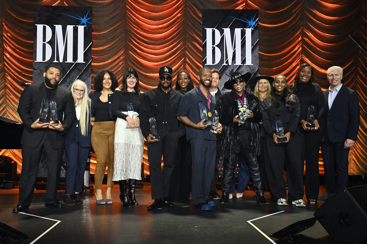 Barbara Cane, VP, Worldwide Creative and Advisor to the EVP, Creative & Licensing, BMI (2nd R), and Michael Steinberg, EVP, Chief Revenue & Creative Officer, BMI (R), present BMI Song of the Year Awards for 