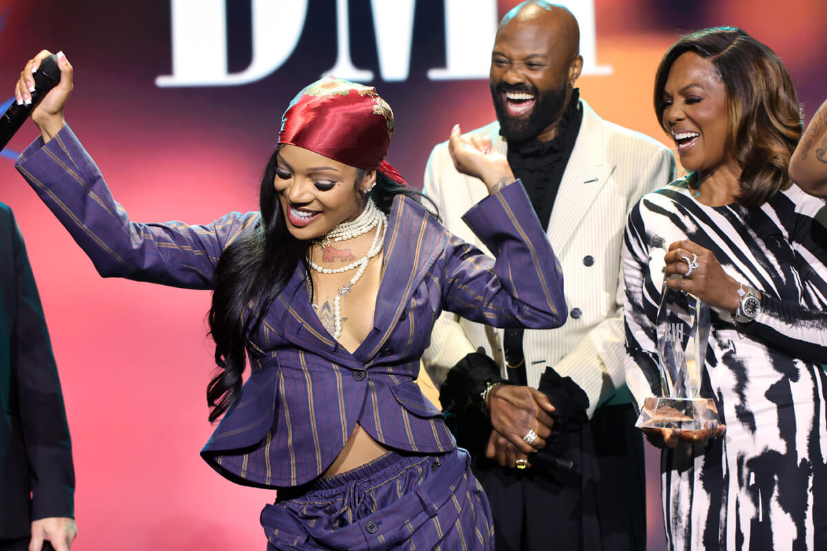GloRilla accepts BMI Impact Award from Wardell Malloy, Assistant VP, Creative, BMI and Catherine Brewton, VP, Creative, BMI onstage during the 2025 BMI R&B/Hip-Hop Awards at Fairmont Century Plaza on August 28, 2025 in Los Angeles, California. (Photo by Arnold Turner/Getty Images for BMI)