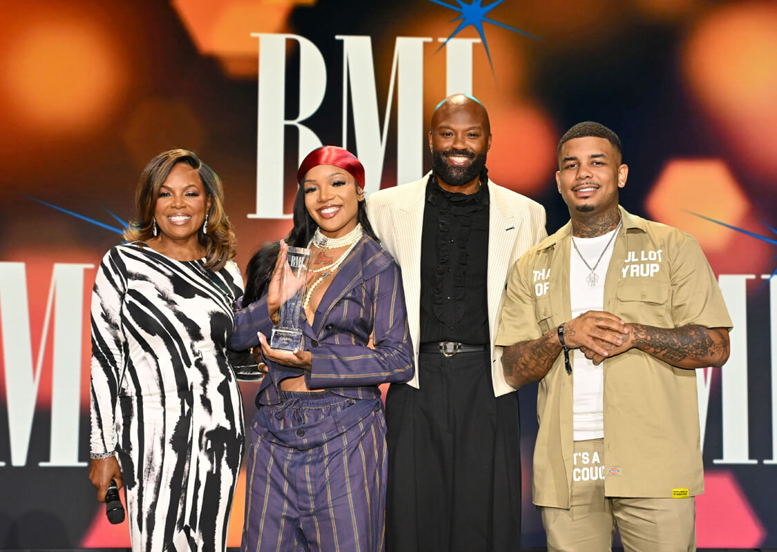 (L-R) Catherine Brewton, VP, Creative, BMI, GloRilla, winner of BMI Impact Award, Wardell Malloy, Assistant VP, Creative, BMI and Rambo onstage during the 2025 BMI R&B/Hip-Hop Awards at Fairmont Century Plaza on August 28, 2025 in Los Angeles, California. (Photo by Lester Cohen/Getty Images for BMI)