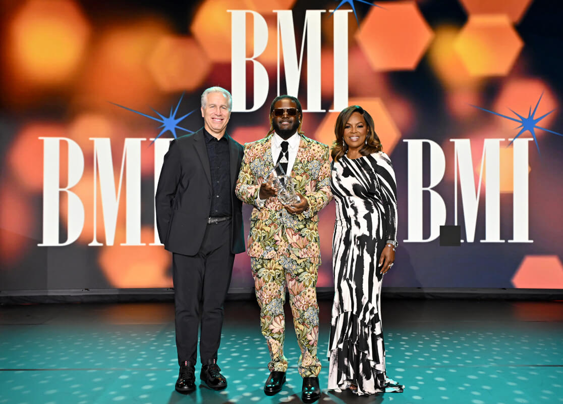 (L-R) Mike Steinberg, EVP, Chief Revenue & Creative Officer, BMI, T-Pain, winner of BMI's President’s Award and Catherine Brewton, VP, Creative, BMI onstage during the 2025 BMI R&B/Hip-Hop Awards at Fairmont Century Plaza on August 28, 2025 in Los Angeles, California. (Photo by Lester Cohen/Getty Images for BMI)