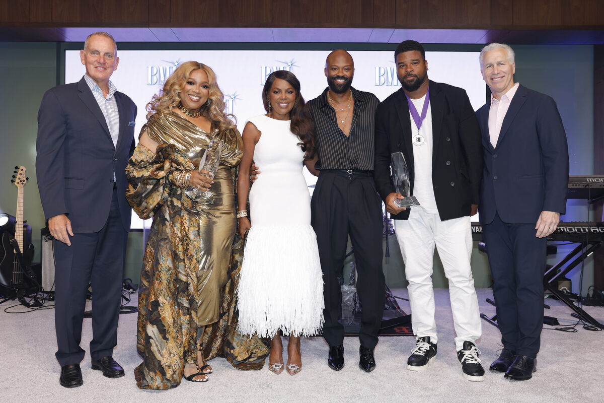 (L-R) Mike O'Neill, CEO of BMI, Kierra Sheard, 2026 BMI Impact Award and Gospel Songwriter of the Year recipient, Catherine Brewton, VP of Creative, BMI Atlanta, Wardell Malloy, Assistant VP of Creative, BMI Atlanta, J. Drew Sheard II, Gospel Songwriter of the Year recipient, and Michael Steinberg, BMI, EVP, Chief Revenue & Creative Officer pose at the 2026 BMI Trailblazers of Gospel Music Awards at BMI on July 21, 2026 in Nashville, Tennessee. (Photo by Jason Kempin/Getty Images for BMI)